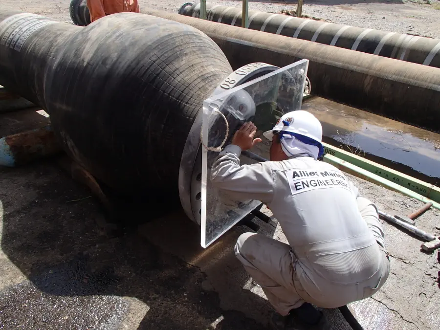 Specialist carrying out marine hose recertification testing