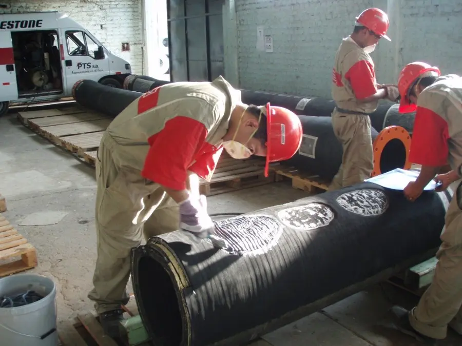 Marine hose training session in a workshop